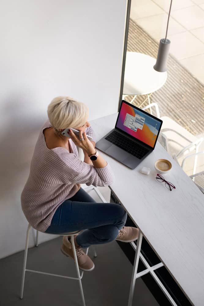 Hopp Solutions image of a project manager working on a laptop.